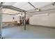 Spacious garage with painted floor, ample lighting, and room for vehicle and storage at 5379 Winslow Xing, Lithonia, GA 30038