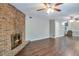 Inviting living room with a classic brick fireplace, hardwood floors, and ample space for entertaining at 5379 Winslow Xing, Lithonia, GA 30038