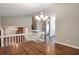 Bright, open-concept living space with hardwood floors and staircase to second level at 5379 Winslow Xing, Lithonia, GA 30038