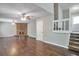 Cozy living room featuring a brick fireplace, hardwood floors, and a warm ambiance at 5379 Winslow Xing, Lithonia, GA 30038