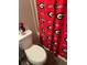 Toilet with Georgia Bulldogs shower curtain and decor at 713 Dove Tree Ln, Social Circle, GA 30025