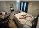 Bedroom with carpet, a queen size bed, motivational decor, and a large mirror at 713 Dove Tree Ln, Social Circle, GA 30025