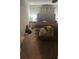 A bedroom with carpet flooring, a queen size bed, and natural light shining in at 713 Dove Tree Ln, Social Circle, GA 30025