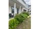 Exterior view of a home with a two-car garage, covered entry, and manicured shrubs at 713 Dove Tree Ln, Social Circle, GA 30025