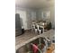 Bright kitchen features stainless steel appliances, a dining area, and granite countertops at 713 Dove Tree Ln, Social Circle, GA 30025