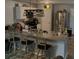 Kitchen with breakfast bar featuring granite countertops and stainless steel appliances at 713 Dove Tree Ln, Social Circle, GA 30025