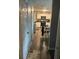 Galley kitchen with stainless steel appliances, white cabinets, and a breakfast area at 713 Dove Tree Ln, Social Circle, GA 30025