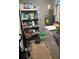 Functional laundry room with storage shelves, a washing machine, and a dryer at 713 Dove Tree Ln, Social Circle, GA 30025