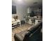 Inviting living room featuring modern lighting, barstool seating, and stylish decor at 713 Dove Tree Ln, Social Circle, GA 30025