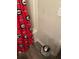 Bathroom shower featuring Georgia Bulldog-themed curtain and vinyl wood flooring at 713 Dove Tree Ln, Social Circle, GA 30025