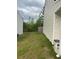 View of the side yard showcasing the lawn and exterior of the home at 713 Dove Tree Ln, Social Circle, GA 30025