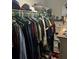 Organized walk-in closet with clothing rack and shelving provides ample storage space for clothes and accessories at 713 Dove Tree Ln, Social Circle, GA 30025