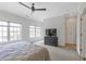 Spacious bedroom with neutral tones, large windows and a ceiling fan at 963 Forrest St, Roswell, GA 30075