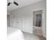 Bright bedroom featuring a ceiling fan, closet, and an attached bathroom with a shower/tub combo at 963 Forrest St, Roswell, GA 30075