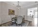 Elegant dining room boasting wainscotting and a stylish chandelier at 963 Forrest St, Roswell, GA 30075