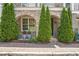 Inviting front of home with brick walkway, trimmed bushes and flower planters at 963 Forrest St, Roswell, GA 30075
