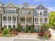 Beautiful townhome exterior with manicured landscaping and a brick facade at 963 Forrest St, Roswell, GA 30075