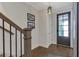 Inviting foyer featuring hardwood floors, a decorative light fixture, and a door with sidelights at 963 Forrest St, Roswell, GA 30075
