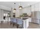 Well-appointed kitchen featuring an island with seating and modern stainless steel appliances at 963 Forrest St, Roswell, GA 30075