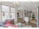 Open-concept space features a living room and kitchen with stainless steel appliances at 963 Forrest St, Roswell, GA 30075