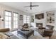 Cozy living room with fireplace, built-in bookshelves, and ample natural light at 963 Forrest St, Roswell, GA 30075