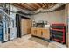 Unfinished basement area with concrete floors, exposed pipes, and storage cabinets at 4050 Arrow Head Trl, Cumming, GA 30041