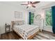 Bright bedroom featuring natural light, a ceiling fan, wood flooring, and tasteful decor at 4050 Arrow Head Trl, Cumming, GA 30041