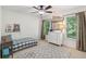 Bedroom featuring a fan, natural light, and tasteful decor at 4050 Arrow Head Trl, Cumming, GA 30041
