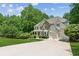 Charming two-story home boasting a covered porch, stone accents, and a three-car garage at 4050 Arrow Head Trl, Cumming, GA 30041