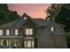 Attractive two-story home featuring stone accents, neutral siding and shutter colors, and a three-car garage at 4050 Arrow Head Trl, Cumming, GA 30041
