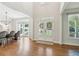 Bright foyer with gleaming hardwood floors, grand entrance, and abundant natural light at 4050 Arrow Head Trl, Cumming, GA 30041