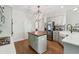 Charming kitchen with a center island, stainless steel appliances, and shaker style cabinets at 4050 Arrow Head Trl, Cumming, GA 30041