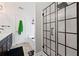 Modern bathroom showcasing the bathtub and the walk-in shower with a grid-style glass door at 577 Joneus Dr, Mcdonough, GA 30252