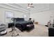 Spacious main bedroom with a tray ceiling, neutral carpet and ample natural light at 577 Joneus Dr, Mcdonough, GA 30252