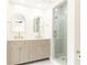 Elegant bathroom features a double vanity with marble countertops and a glass shower at 79 Anniston Se Ave, Atlanta, GA 30317