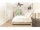 Cozy bedroom with a neutral color palette, a large window, and ample natural light at 79 Anniston Se Ave, Atlanta, GA 30317