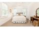 Bright bedroom featuring neutral tones, carpeted floors, and natural light from the double windows at 79 Anniston Se Ave, Atlanta, GA 30317