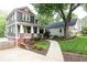 Charming home exterior with a well-manicured front yard, inviting porch, and long driveway at 79 Anniston Se Ave, Atlanta, GA 30317