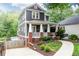Charming two-story home with a welcoming front porch and well-maintained landscaping at 79 Anniston Se Ave, Atlanta, GA 30317
