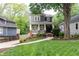 Charming home exterior with a well-manicured front lawn and a inviting front porch with brick accents at 79 Anniston Se Ave, Atlanta, GA 30317