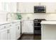 Kitchen details include white cabinets, marble countertops, subway tile backsplash, and stainless steel appliances at 79 Anniston Se Ave, Atlanta, GA 30317