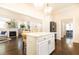 Open-concept kitchen with white island flows into the living room, creating a spacious entertaining area at 79 Anniston Se Ave, Atlanta, GA 30317