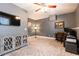 Home office with modern décor, gray walls, ceiling fan, and a work space with a desk at 79 Anniston Se Ave, Atlanta, GA 30317