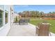 Back patio with table and chairs, perfect for outdoor dining and entertaining at 1245 Elowen Dr, Austell, GA 30168