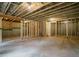 Unfinished basement with exposed ceiling insulation and framed walls, ready for customization at 1245 Elowen Dr, Austell, GA 30168