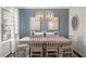 Elegant dining room with a modern chandelier, a large table, and stylish decor at 1245 Elowen Dr, Austell, GA 30168