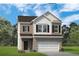 Charming two-story home with a brick and white siding, a two-car garage, and a well-maintained lawn at 1245 Elowen Dr, Austell, GA 30168