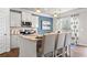 Modern kitchen with stainless steel appliances, a granite countertop island, and white cabinets at 1245 Elowen Dr, Austell, GA 30168