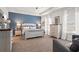 Spacious main bedroom with a tray ceiling, two windows, and elegant furniture at 1245 Elowen Dr, Austell, GA 30168