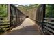 Picturesque bridge amidst a lush green landscape. A bicycle rests nearby at 1245 Elowen Dr, Austell, GA 30168